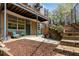 Relaxing patio offers outdoor seating, dining space, and a scenic view of the landscaped terrace at 400 Village Ne Pkwy # 203, Atlanta, GA 30306