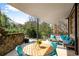 Relaxing covered patio with comfortable seating and outdoor dining area, perfect for entertaining at 400 Village Ne Pkwy # 203, Atlanta, GA 30306