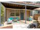 Charming covered patio features comfortable seating, dining set, and convenient access to the unit entrance at 400 Village Ne Pkwy # 203, Atlanta, GA 30306