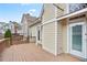 View of a wooden deck and the home's exterior, showcasing the backyard and neighboring houses at 4093 Tritt Homestead Dr, Marietta, GA 30062