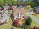 A lush backyard view boasts a multilevel deck, mature trees, flowering shrubs, and well-maintained lawn at 4093 Tritt Homestead Dr, Marietta, GA 30062