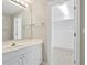 Elegant bathroom with a vanity sink and an open door to a walk-in closet at 4093 Tritt Homestead Dr, Marietta, GA 30062