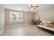 Spacious bedroom features a ceiling fan, window, and tile floors at 4093 Tritt Homestead Dr, Marietta, GA 30062