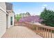 Expansive wooden deck with views of flowering trees and the surrounding neighborhood at 4093 Tritt Homestead Dr, Marietta, GA 30062