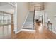 Grand foyer showcasing hardwood floors, a staircase, and an open layout to the living spaces at 4093 Tritt Homestead Dr, Marietta, GA 30062