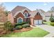 Beautiful brick home with a well-manicured lawn and a two-car garage at 4093 Tritt Homestead Dr, Marietta, GA 30062