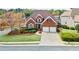 Beautiful brick home with a well-manicured lawn and a two-car garage at 4093 Tritt Homestead Dr, Marietta, GA 30062