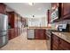 Kitchen featuring modern appliances, granite countertops, and stylish hardwood cabinets at 4093 Tritt Homestead Dr, Marietta, GA 30062