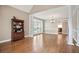 Spacious living room featuring hardwood floors, a large cabinet, and big windows at 4093 Tritt Homestead Dr, Marietta, GA 30062