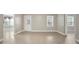 Neutral living room showcasing natural light with windows and a door to the outside at 4093 Tritt Homestead Dr, Marietta, GA 30062