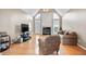 Bright living room with hardwood floors, large windows, fireplace, and vaulted ceilings at 4093 Tritt Homestead Dr, Marietta, GA 30062