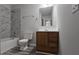 A full bathroom features a shower/tub, updated vanity with drawers, and tiled floors at 890 Shiloh Ridge Nw Run, Kennesaw, GA 30144