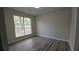 Cozy bedroom with natural light and laminate flooring at 890 Shiloh Ridge Nw Run, Kennesaw, GA 30144