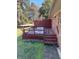 Backyard view of the deck, grill, and side of the house at 1511 Stonewood Dr, Norcross, GA 30093