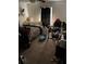 Messy bedroom featuring a queen bed, television, and carpeted floor at 1511 Stonewood Dr, Norcross, GA 30093