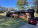 Charming brick home with manicured lawn, inviting entrance, and ample parking space at 1511 Stonewood Dr, Norcross, GA 30093