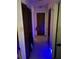 Image of a hallway with wooden doors and blue accent lighting at 1511 Stonewood Dr, Norcross, GA 30093