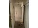 Bright hallway with multiple closets, offering ample storage and leading to various rooms within the home at 1511 Stonewood Dr, Norcross, GA 30093
