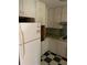 Well-lit kitchen with classic cabinetry, offering potential for renovation and personalization to suit any homeowner's taste at 1511 Stonewood Dr, Norcross, GA 30093