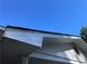 Shows peeling paint and trim damage on a roof area needing repair with a blue sky in the background at 1511 Stonewood Dr, Norcross, GA 30093