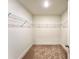 Walk-in closet with carpeted floors and wire shelving at 421 Auburn Valley Way, Auburn, GA 30011