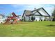 Beautiful single Gathering home with a spacious yard and wooden playset at 421 Auburn Valley Way, Auburn, GA 30011