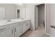 Well-lit bathroom with double vanity, modern fixtures, and tile flooring for a clean, stylish look at 4229 Brookmont Way, Auburn, GA 30011