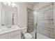 Modern bathroom with a tiled shower, white vanity, and sleek fixtures at 4229 Brookmont Way, Auburn, GA 30011