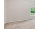 Bright bedroom with a neutral carpet and a large window overlooking the yard at 4229 Brookmont Way, Auburn, GA 30011