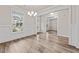Elegant dining room featuring hardwood floors, wainscoting, and natural light at 4229 Brookmont Way, Auburn, GA 30011