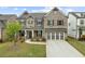 Charming two-story home with stone and brick facade and well-manicured lawn at 4229 Brookmont Way, Auburn, GA 30011