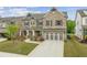 Beautiful two-story home featuring stone and brick accents and a spacious driveway at 4229 Brookmont Way, Auburn, GA 30011