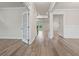 Bright foyer with hardwood flooring, white trim, and an elegant doorway at 4229 Brookmont Way, Auburn, GA 30011