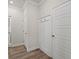 Hallway with a board and batten accent wall and hooks at 4229 Brookmont Way, Auburn, GA 30011