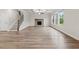 Spacious living room with hardwood floors, fireplace, and abundant natural light at 4229 Brookmont Way, Auburn, GA 30011