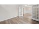 Spacious living room with hardwood floors and an open doorway to the dining room at 4229 Brookmont Way, Auburn, GA 30011