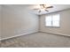 Bright bedroom featuring plush gray carpet, one window and neutral painted walls at 68 Hampshire Ct, Avondale Estates, GA 30002