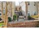 Welcoming entrance to townhome with brick accents and clear signage at 68 Hampshire Ct, Avondale Estates, GA 30002