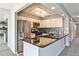 The kitchen has stainless steel appliances, granite countertops, modern backsplash, and ample cabinet space at 68 Hampshire Ct, Avondale Estates, GA 30002