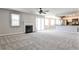 Bright living room featuring a fireplace, sliding glass doors, and neutral carpeting at 68 Hampshire Ct, Avondale Estates, GA 30002
