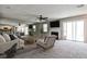 This living room is styled with plush furniture, a large fireplace and direct access to the kitchen and dining room at 68 Hampshire Ct, Avondale Estates, GA 30002