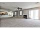 The living room has an open floor plan that connects to the kitchen and fireplace with bright natural lighting at 68 Hampshire Ct, Avondale Estates, GA 30002