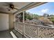 Relax on this inviting patio with a fan, featuring lattice railing and a charming view at 68 Hampshire Ct, Avondale Estates, GA 30002