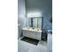 Bathroom features a double sink vanity, tile floors and a large mirror at 2669 Ambria Dr, Buford, GA 30519