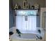 Relaxing bathroom with a soaking tub and neutral decor, creating a spa-like retreat at 2669 Ambria Dr, Buford, GA 30519