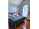 Bedroom with hardwood floors and a bright, arched window and stuffed animals at 2669 Ambria Dr, Buford, GA 30519