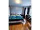 Bedroom with neutral walls and a large bed, features a desk with chair by a window at 2669 Ambria Dr, Buford, GA 30519