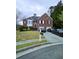 Charming two-story brick home with well-maintained lawn and driveway parking at 2669 Ambria Dr, Buford, GA 30519