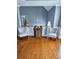 Upstairs hallway with hardwood floors, a decorative barrel, and two chairs at 2669 Ambria Dr, Buford, GA 30519