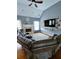 Inviting living room features a cozy fireplace, TV, hardwood floors, and comfortable seating, perfect for relaxation at 2669 Ambria Dr, Buford, GA 30519